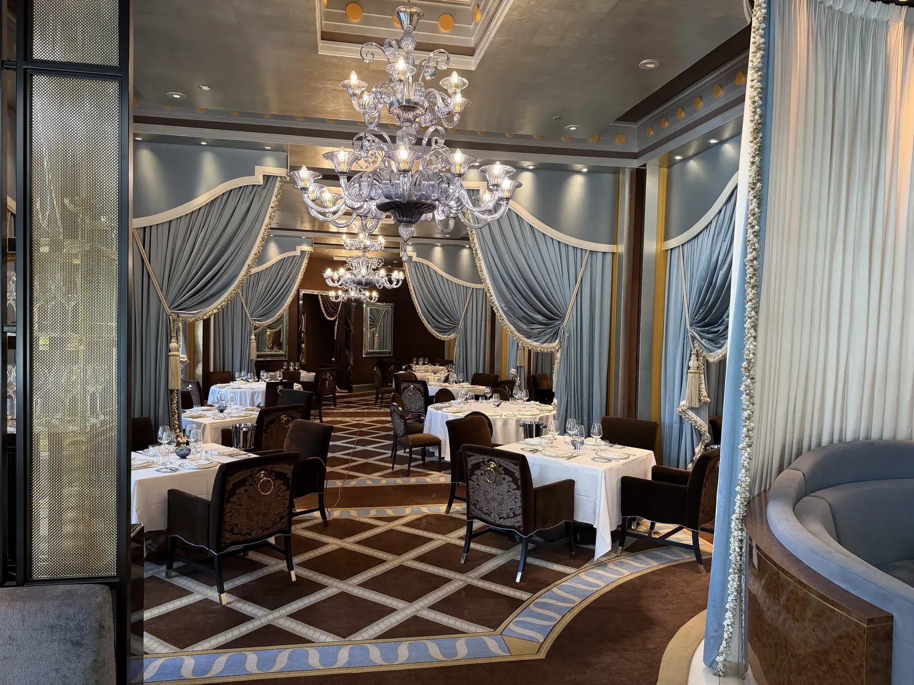 A fully set dining room inside a luxury property